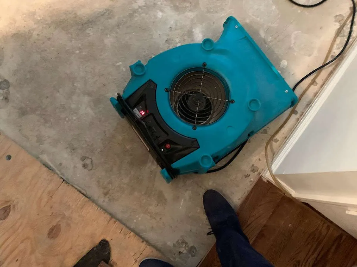 Air mover drying subfloor during Leak Detection & Repair in Huntington Beach